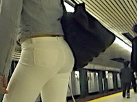 I'm filming the girl as she's walking up the stairs in the subway. From this angle her hot ass in white jeans looks even hotter
