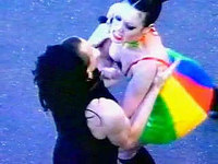 Crazy chick in a crazy rainbow outfit fights with another girl fiercefully and makes it pretty easy to record her sweet downblouse!